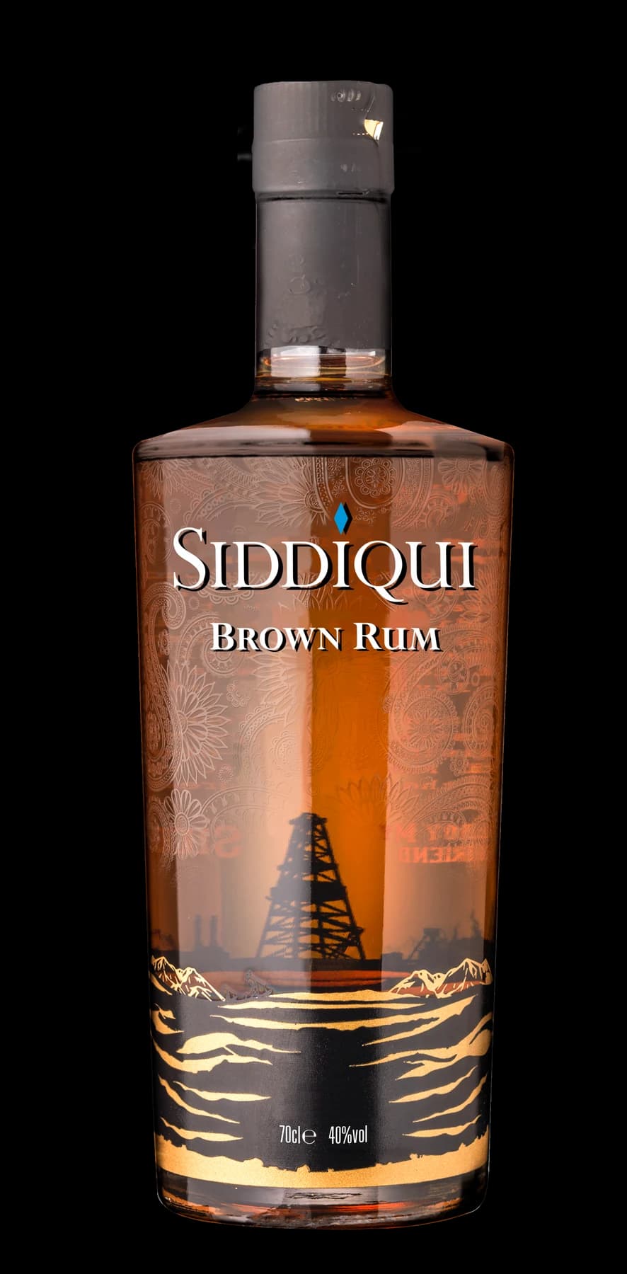 Siddiqui Brown Rum bottle: paisley engraving over an industrial skyline, mountains and gold waves